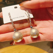 Brinco Pérola Brilhante <strong>(COMPRE 1 PAR LEVE 2)</strong>